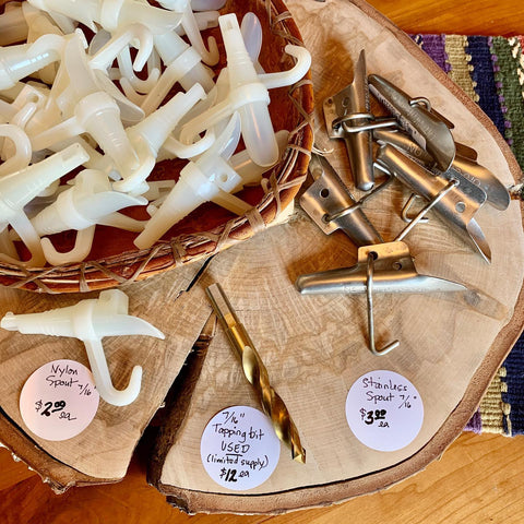 Three types of Birch Syrup Tree Taps on a wooden surface