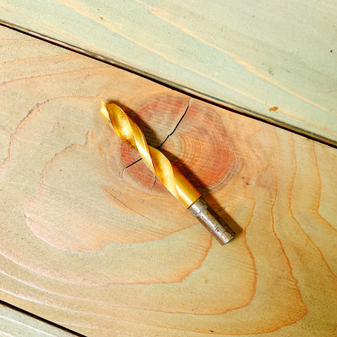 Tapping Drill Bit 7/16"on a wooden surface